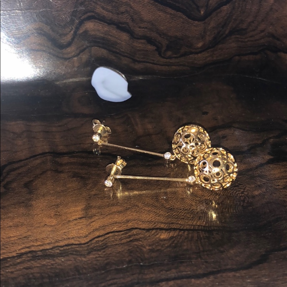 Movado dangle yellow gold earrings